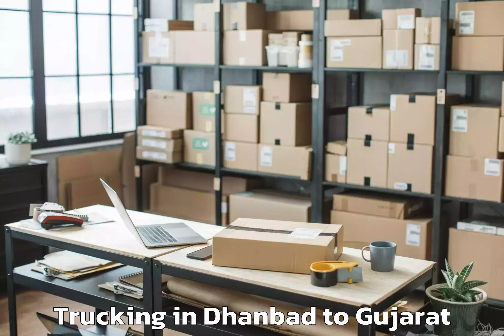 Reliable Dhanbad to Waghai Trucking